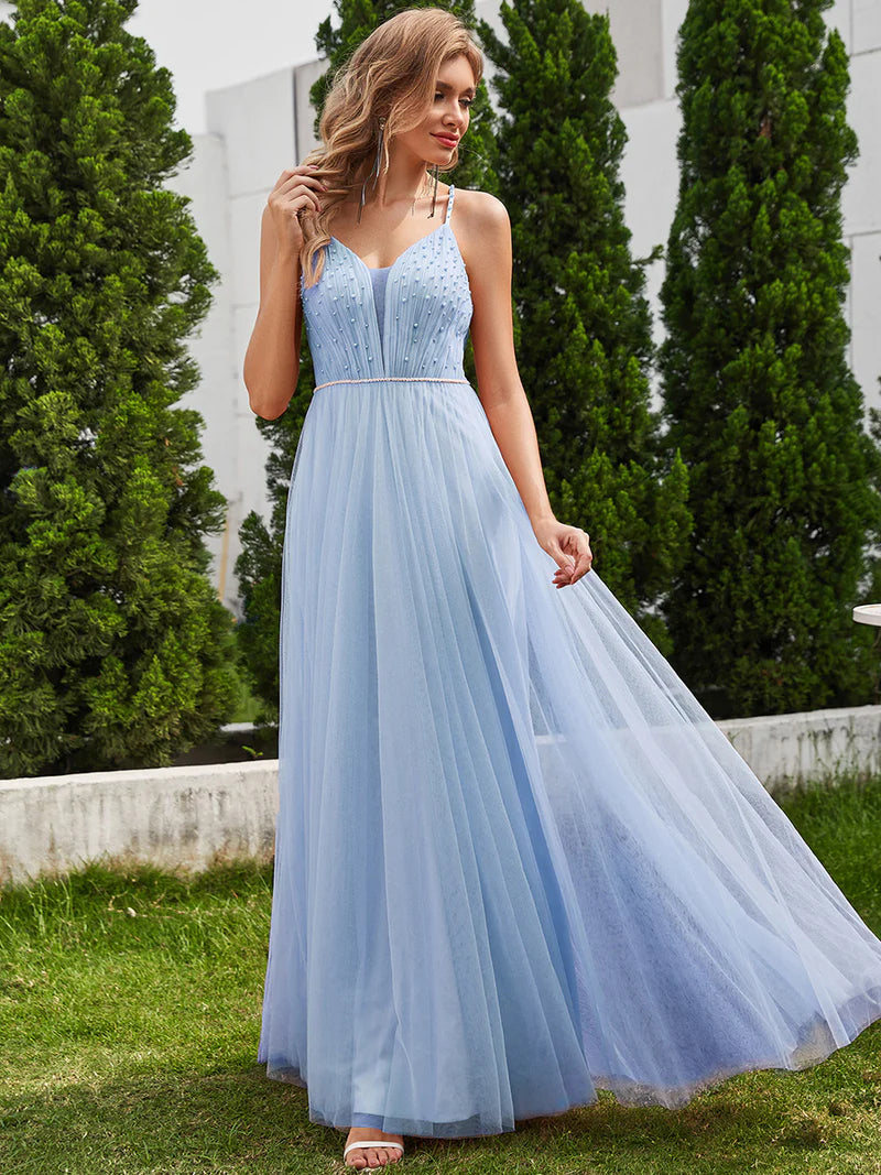 Sky blue formal tulle dress with beaded pearl top and spaghetti straps.